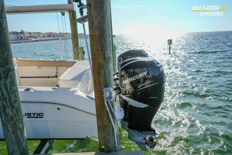 Slide: The Image of 2018 Key West Billistic 351 Center Console with Mercury engines docked by the sea. - 183