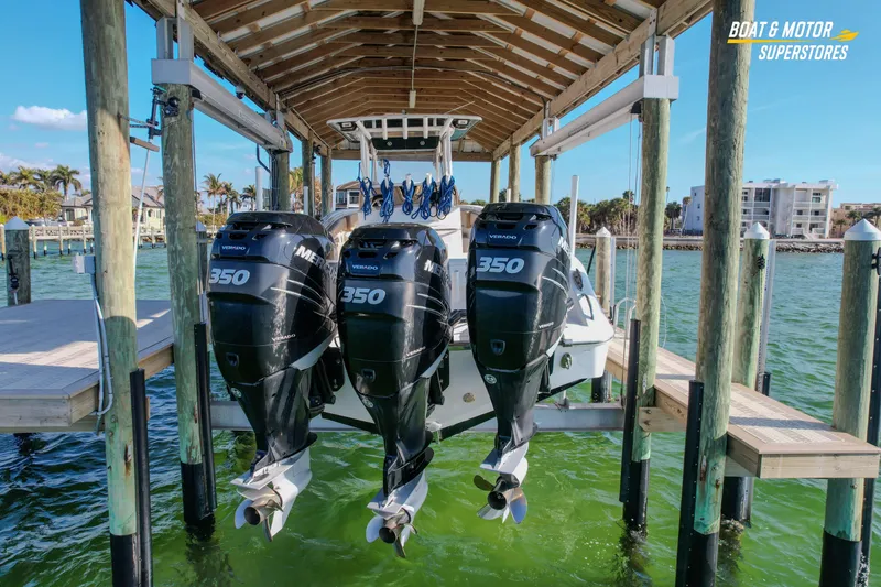 Slide: The Image of 2018 Key West Billistic 351 Center Console with triple Mercury 350 engines on a lift. - 20