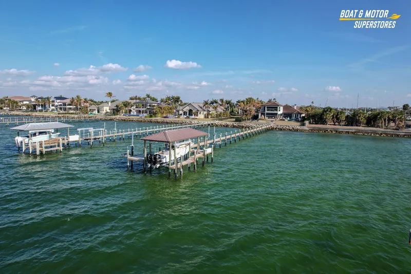 Slide: The Image of Aerial view of 2018 Key West Billistic 351 Center Console docked by waterfront homes. - 25