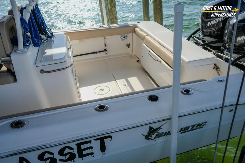 Slide: The Image of 2018 Key West Billistic 351 Center Console boat interior with seating and storage. - 33