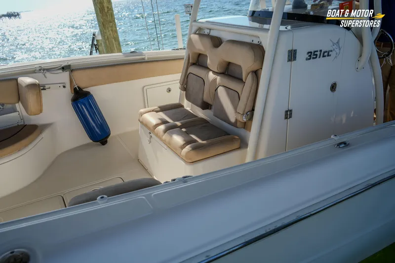 Slide: The Image of 2018 Key West Billistic 351 Center Console interior with cushioned seating and ocean view. - 34