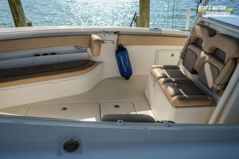 Slide: The Image of 2018 Key West Billistic 351 Center Console interior with cushioned seating and ocean view. - 35