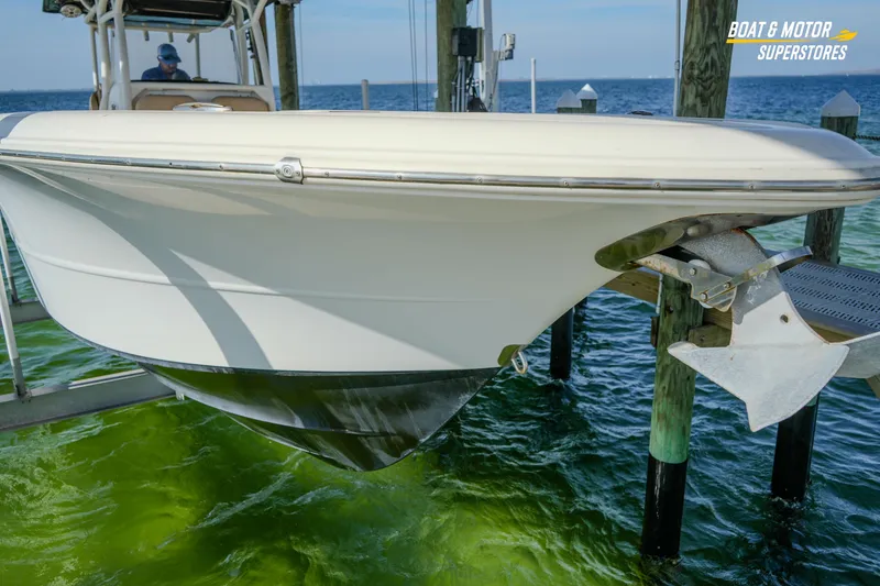 Slide: The Image of 2018 Key West Billistic 351 Center Console boat docked by the water. - 41
