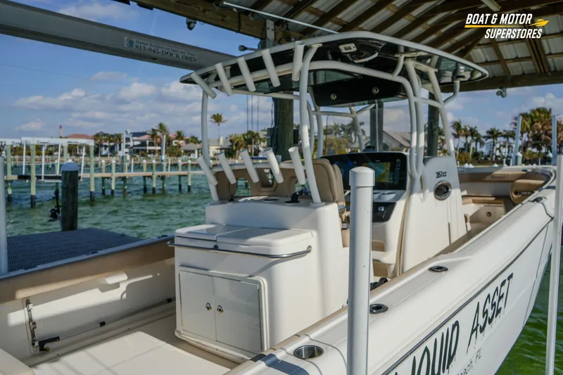 Slide: The Image of 2018 Key West Billistic 351 Center Console docked at marina, sunny day. - 43
