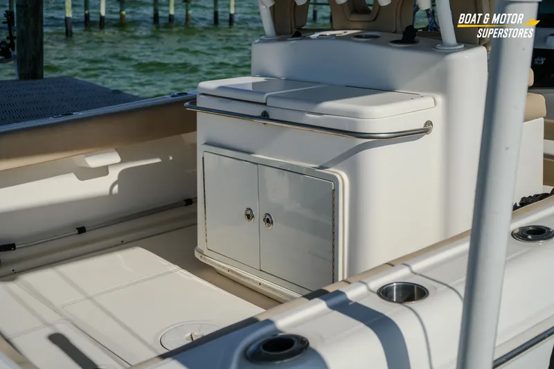 Slide: The Image of 2018 Key West Billistic 351 Center Console interior with storage and seating. - 44