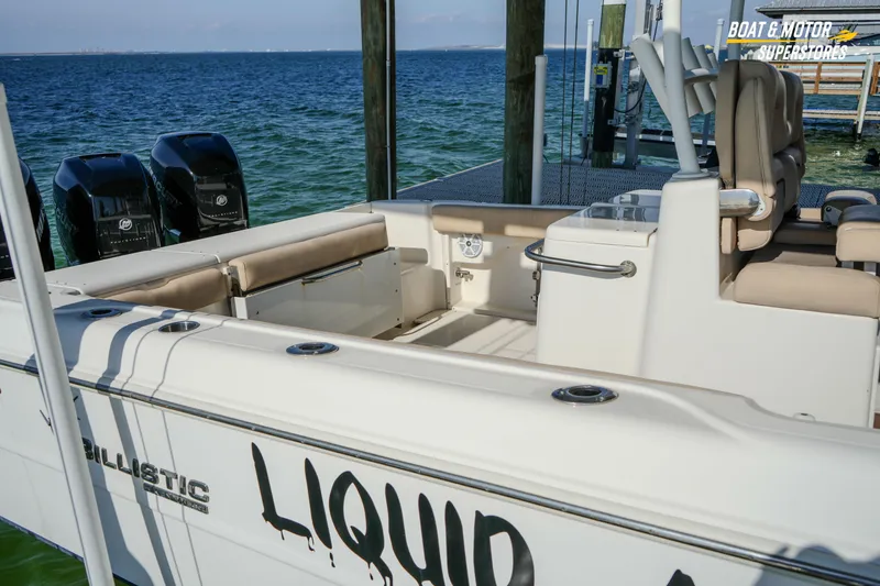 Slide: The Image of 2018 Key West Billistic 351 Center Console boat docked with triple outboard engines. - 54