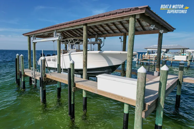 Slide: The Image of 2018 Key West Billistic 351 Center Console on dock lift, ocean backdrop. - 6
