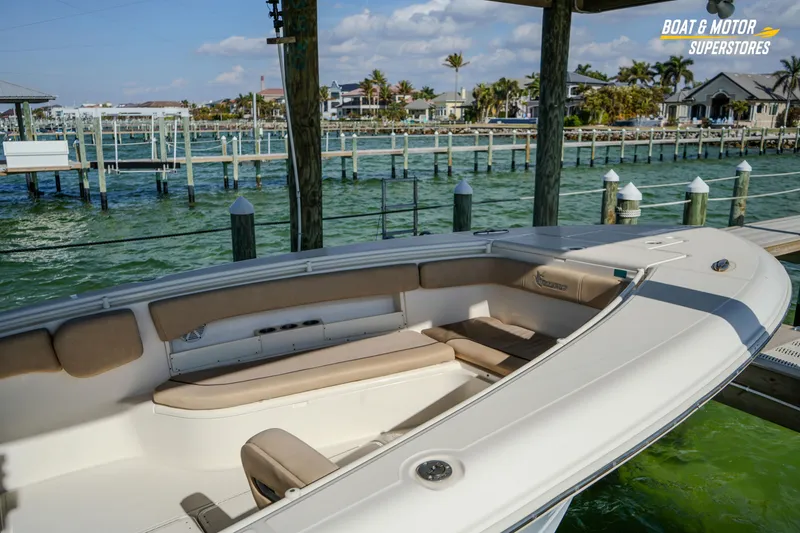 Slide: The Image of 2018 Key West Billistic 351 Center Console docked by waterfront homes. - 60