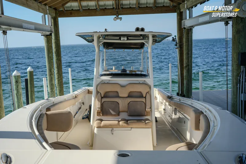 Slide: The Image of 2018 Key West Billistic 351 Center Console boat docked by the ocean. - 64