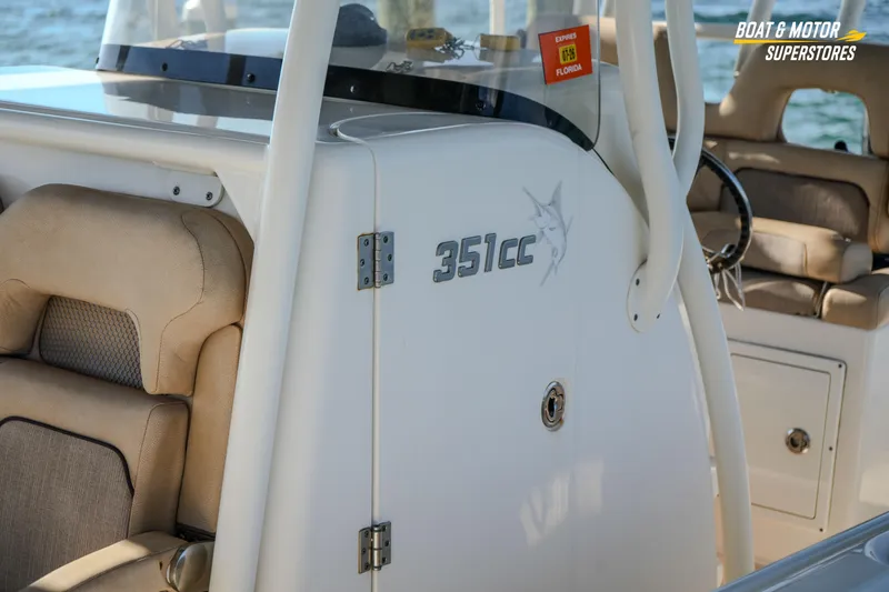 Slide: The Image of 2018 Key West Billistic 351 Center Console boat interior with seating and console details. - 72