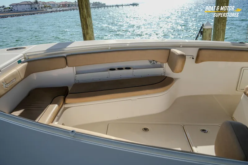 Slide: The Image of 2018 Key West Billistic 351 Center Console boat interior with cushioned seating and ocean view. - 75