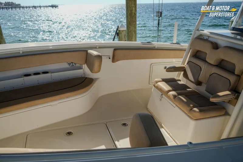 Slide: The Image of 2018 Key West Billistic 351 Center Console interior with cushioned seating, ocean view. - 76