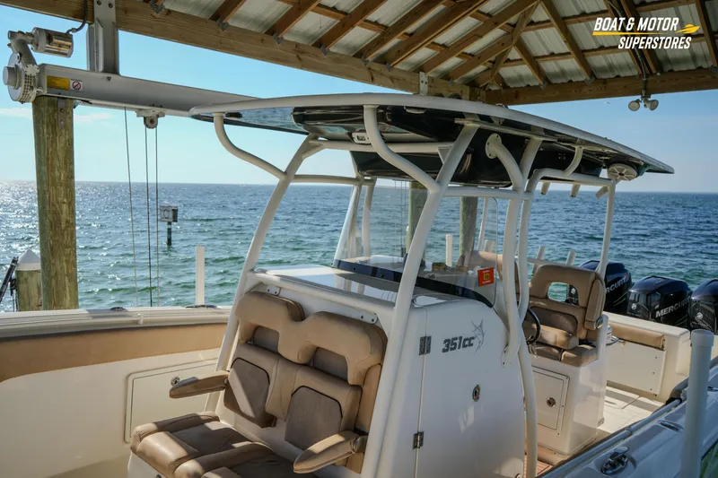 Slide: The Image of 2018 Key West Billistic 351 Center Console boat docked by the ocean. - 78