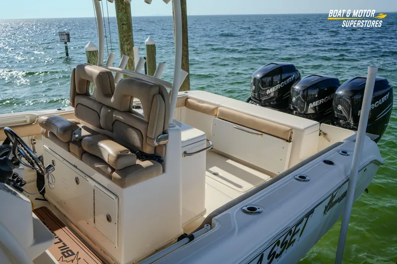 Slide: The Image of 2018 Key West Billistic 351 Center Console boat with triple Mercury engines on the water. - 81