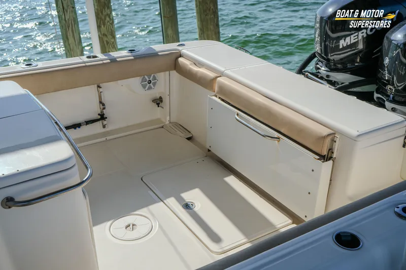 Slide: The Image of 2018 Key West Billistic 351 Center Console boat interior with seating and storage. - 83