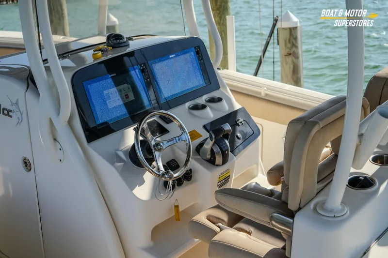Slide: The Image of 2018 Key West Billistic 351 Center Console helm with dual screens and steering wheel. - 92