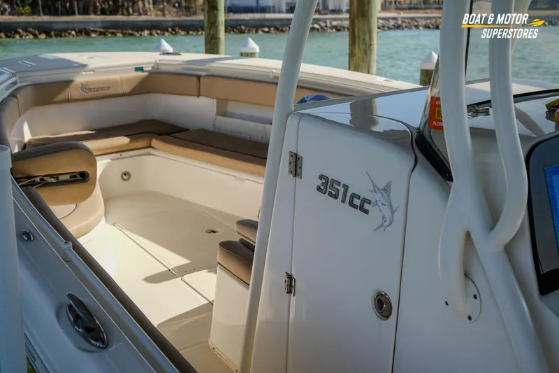 Slide: The Image of 2018 Key West Billistic 351 Center Console boat interior with seating and storage. - 93