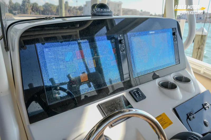Slide: The Image of 2018 Key West Billistic 351 Center Console dashboard with dual Simrad displays. - 94