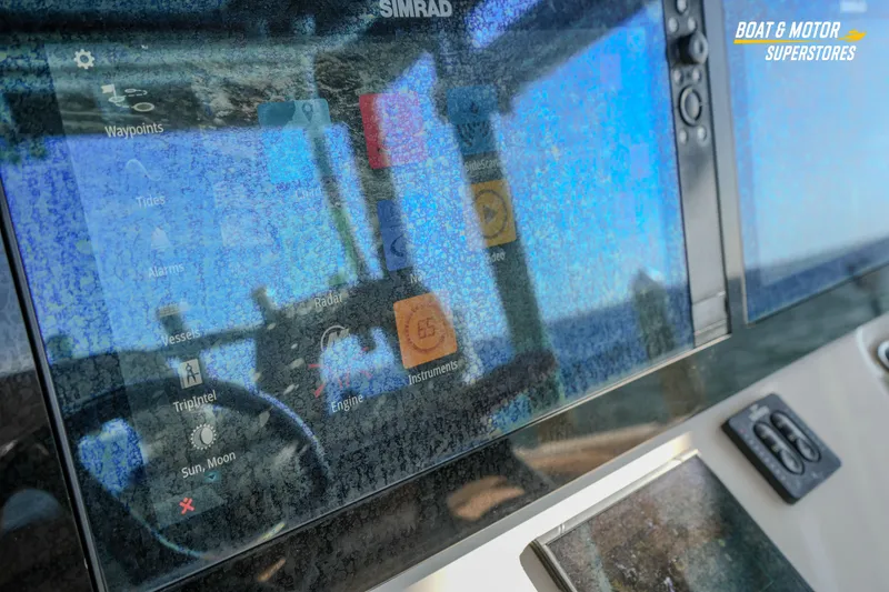 Slide: The Image of 2018 Key West Billistic 351 Center Console with Simrad navigation display. - 95