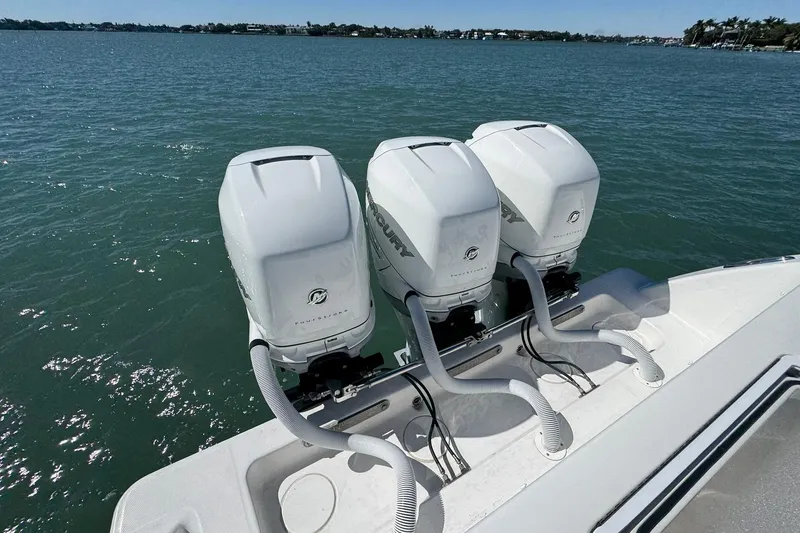 Slide: The Image of Triple Mercury outboard engines on a 2019 Invincible 39 Open Fisherman boat. - 17