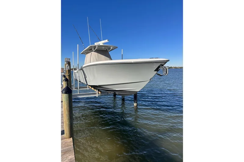 Slide: The Image of 2019 Invincible 39 Open Fisherman boat docked above water. - 20