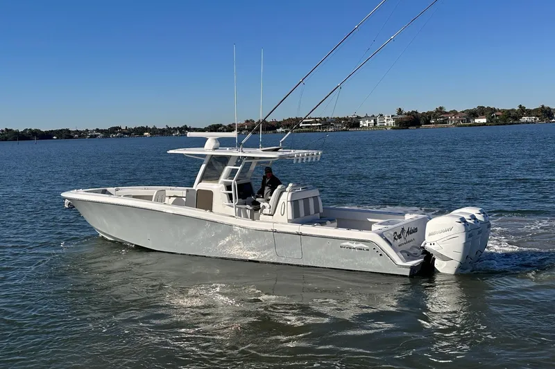 Slide: The Image of 2019 Invincible 39 Open Fisherman boat cruising on calm waters. - 26
