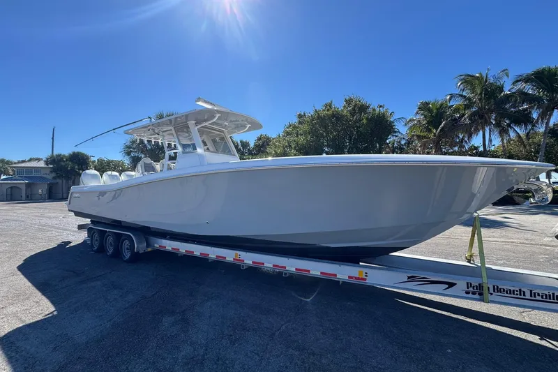 Slide: The Image of 2019 Invincible 39 Open Fisherman boat on trailer under clear blue sky. - 31