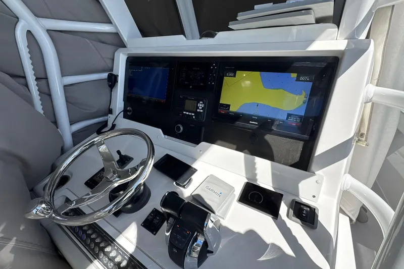 Slide: The Image of 2019 Invincible 39 Open Fisherman helm with Garmin navigation displays and controls. - 6