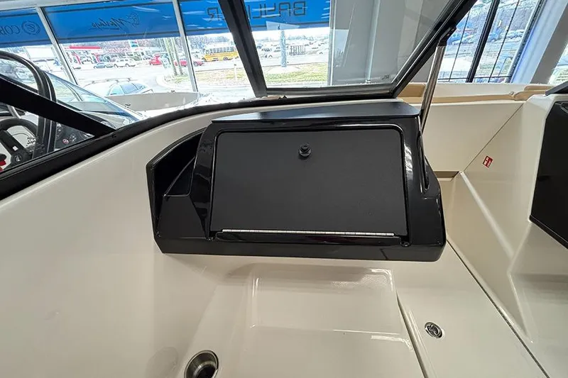 Slide: The Image of 2026 Bayliner V20 boat interior with sleek dashboard and modern design. - 15