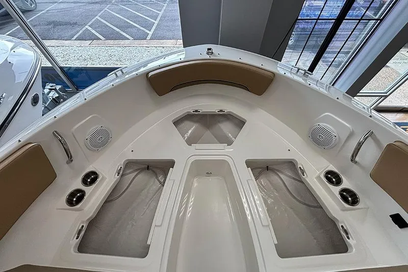 Slide: The Image of 2026 Bayliner V20 boat interior with seating, cup holders, and speakers. - 22