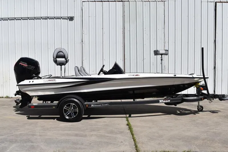 The Image of 2026 Lowe Skorpion SS boat on Triton trailer, parked outdoors. - 0