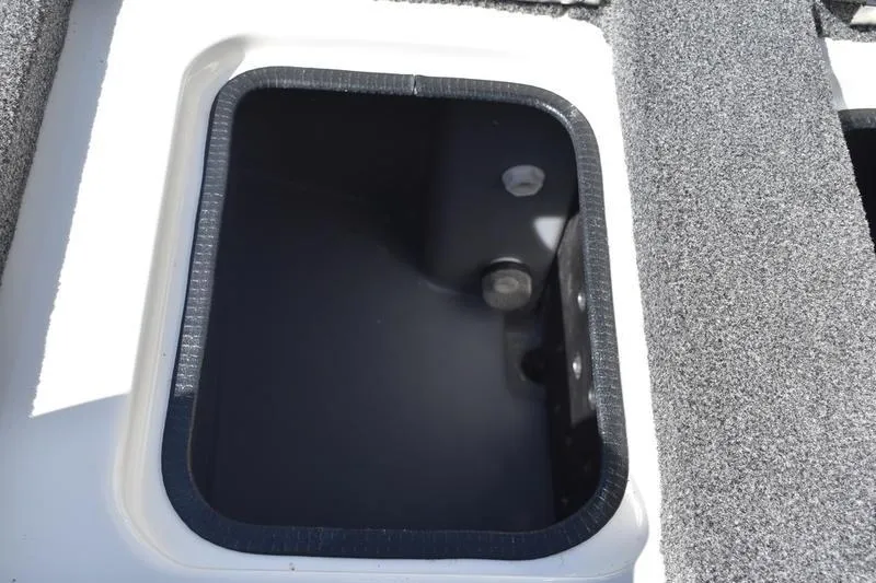 Slide: The Image of Open storage compartment on 2026 Lowe Skorpion SS boat deck. - 10