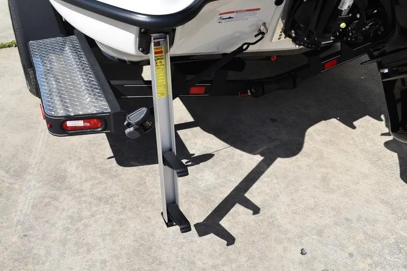 Slide: The Image of Rear view of 2026 Lowe Skorpion SS boat trailer with step ladder. - 15