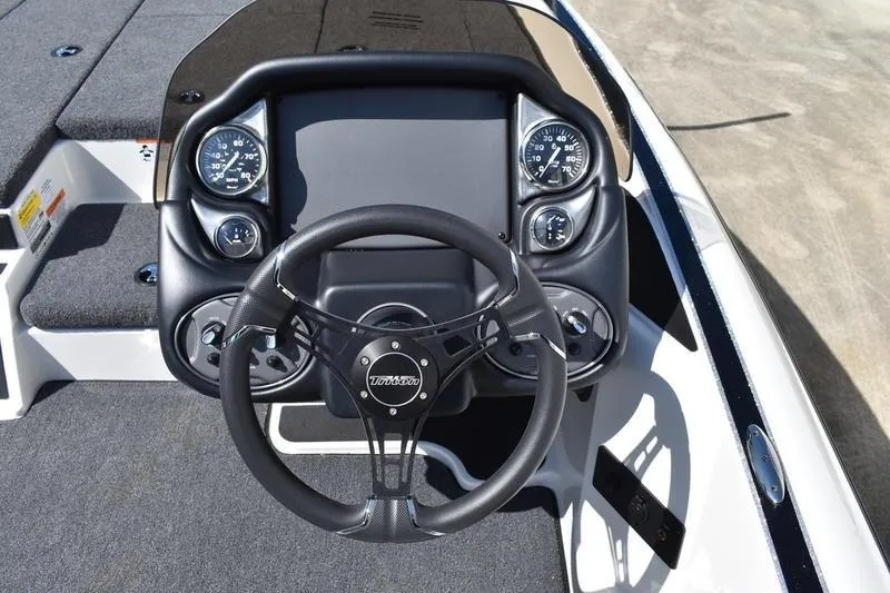 Slide: The Image of Steering console of 2026 Lowe Skorpion SS boat with gauges and controls. - 28