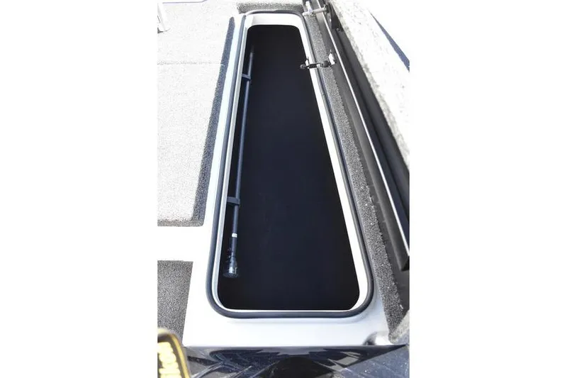Slide: The Image of Storage compartment of 2026 Lowe Skorpion SS boat, featuring sleek design and ample space. - 31