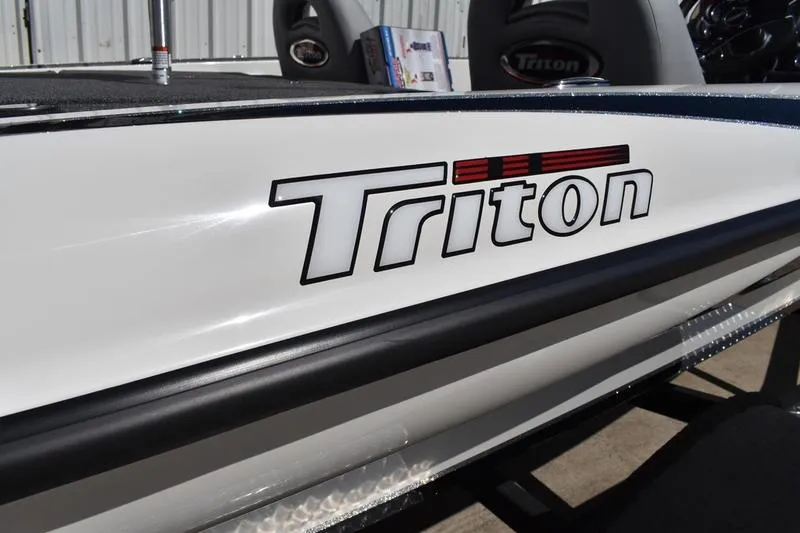 Slide: The Image of White Triton boat with logo, featuring Lowe Skorpion SS 2026 model details. - 32
