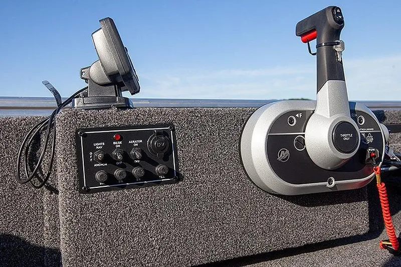 Slide: The Image of Control panel of 2026 Lowe Skorpion SS boat with throttle and switches. - 4