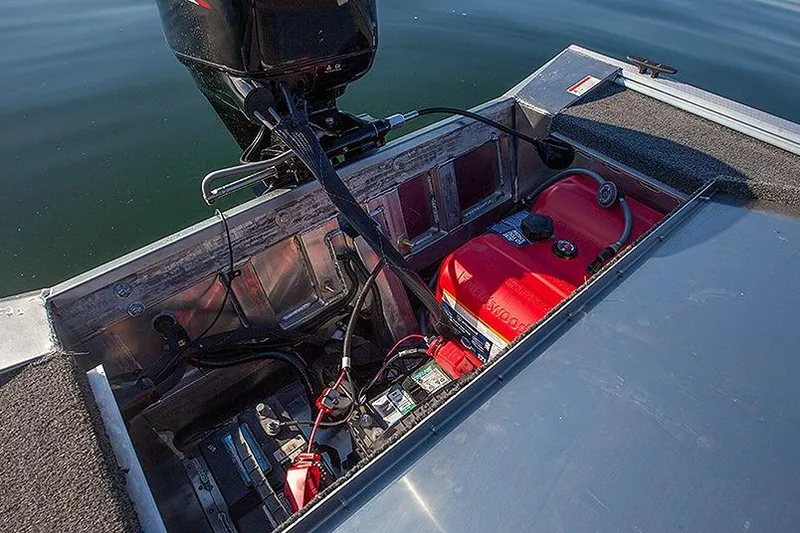 Slide: The Image of 2026 Lowe Skorpion SS boat engine compartment with battery and fuel tank. - 5