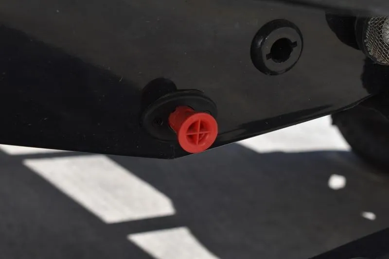 Slide: The Image of Red plug on Lowe Skorpion SS 2026 boat hull, close-up view. - 7