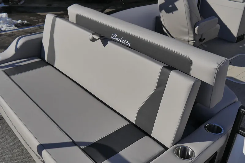 Slide: The Image of 2026 Barletta Aria 24UC boat seating with cup holders, featuring sleek gray upholstery. - 5