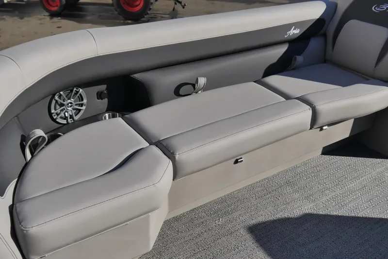 Slide: The Image of 2026 Barletta Aria 24UC boat interior with gray seating and speaker system. - 9