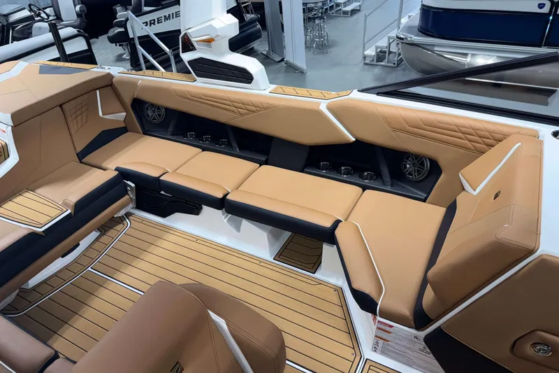 Slide: The Image of Luxurious interior of 2026 Nautique Super Air Nautique S23 with tan seating and modern design. - 10