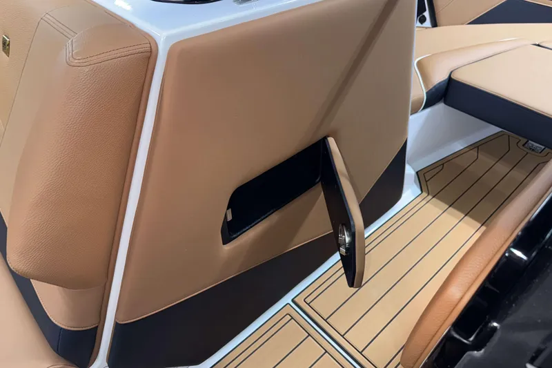 Slide: The Image of 2026 Nautique Super Air Nautique S23 interior with tan leather and sleek design. - 23