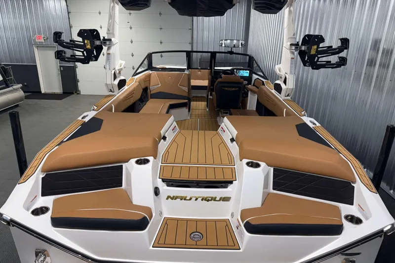 Slide: The Image of 2026 Nautique Super Air Nautique S23 boat interior with tan seating and modern design. - 3