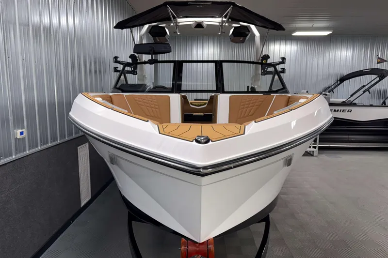 Slide: The Image of 2026 Nautique Super Air Nautique S23 boat in showroom, sleek design, luxury interior. - 37