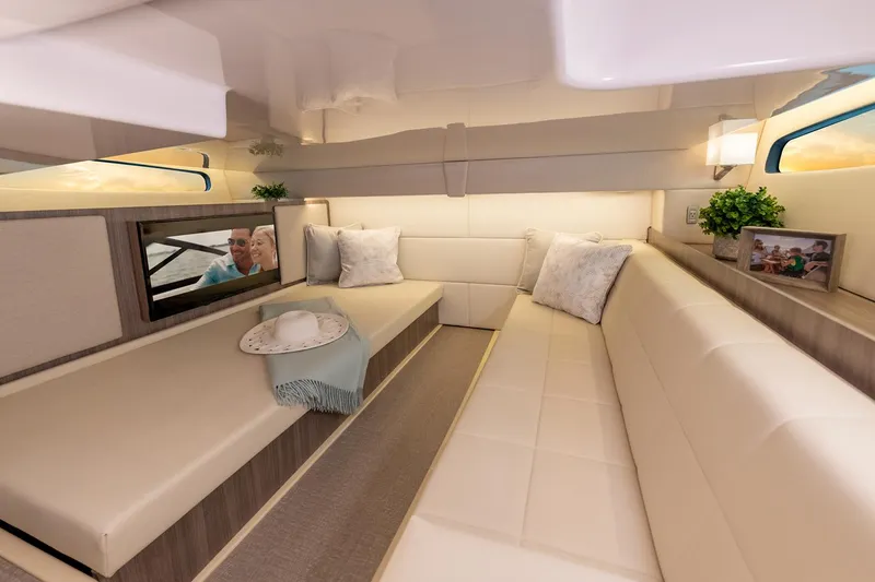 Slide: The Image of 2021 Regal 36 XO boat engines covered, docked on calm green water. - 21