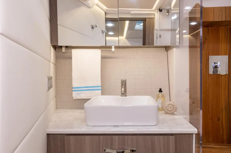 Slide: The Image of Luxurious cabin interior of 2021 Regal 36 XO yacht with cozy bedding. - 24