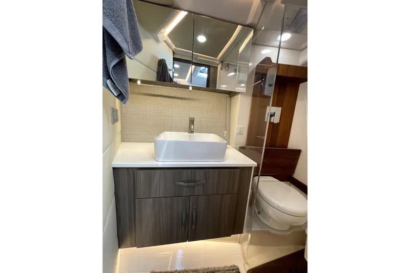 Slide: The Image of Modern bathroom in 2021 Regal 36 XO yacht with sleek vanity and glass shower. - 34