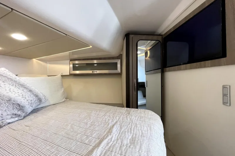 Slide: The Image of Luxurious interior cabin of 2021 Regal 36 XO yacht with modern amenities. - 40