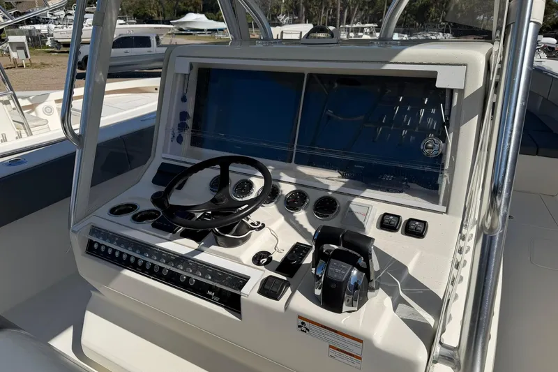 Slide: The Image of 2021 SeaVee 390Z boat dashboard with steering wheel and control panel. - 14